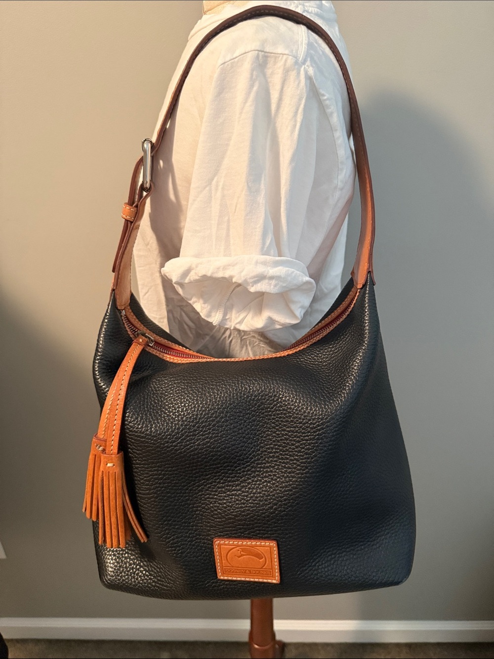 Dooney & Bourke Black and Tan Pebbled Leather Hobo with Tassel